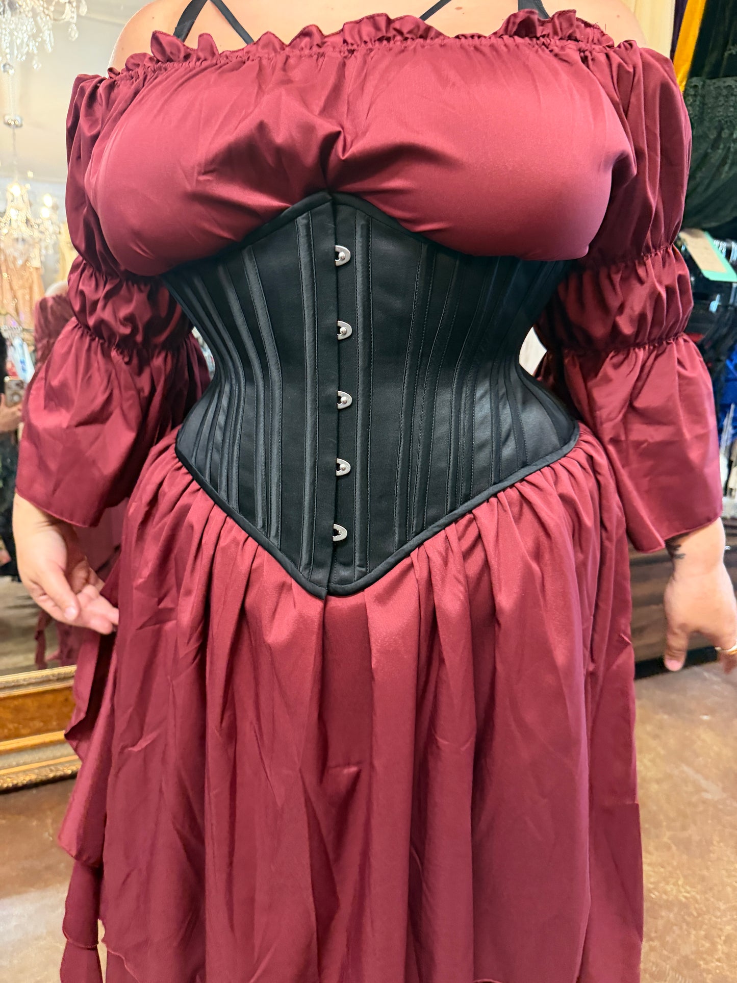 woman in red dress and black corset