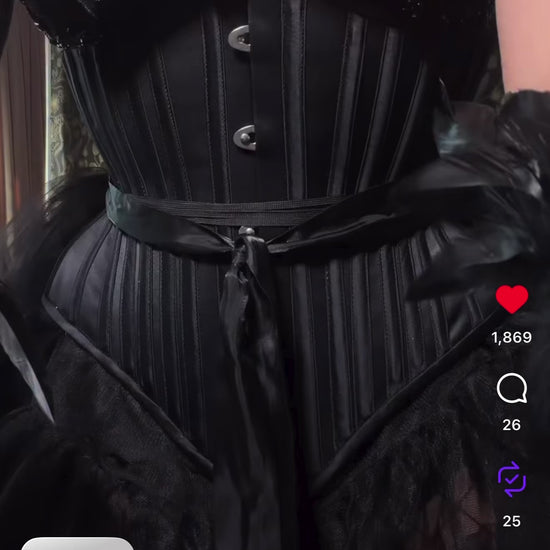 Gothic model in all black wearing victorian inspired corset